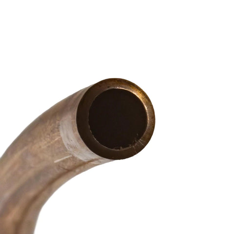 Close-up of copper-nickel brake line tubing end from a curved coil, 3/16 inch diameter.