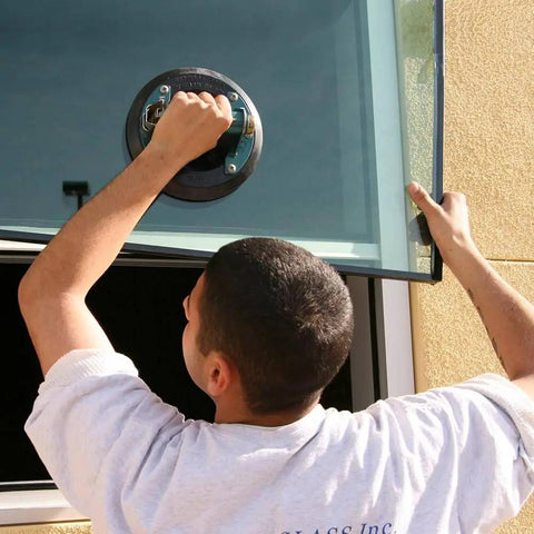 Person using 8 Inch Suction Cup with Metal Handle for lifting glass, demonstrating Heavy Duty Vacuum Mount for smooth nonporous surfaces.