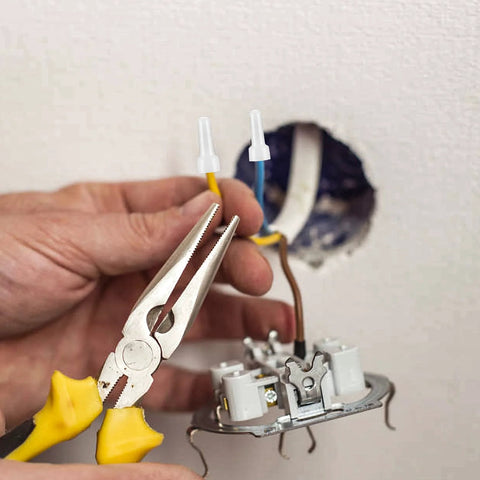 Closed-end nylon insulated crimp connector being crimped onto yellow wire with pliers, CE1 CE2 CE5 kit.