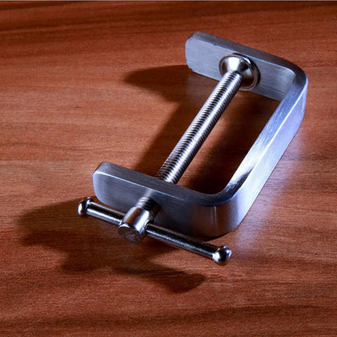 Kyien stainless steel C-clamp on wooden surface, silver metal tool with long threaded screw