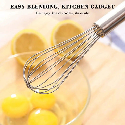 Close-up of Go-To Stainless Steel Balloon Whisk in action with eggs, highlighting rust-resistant 12-inch whisk for cooking.