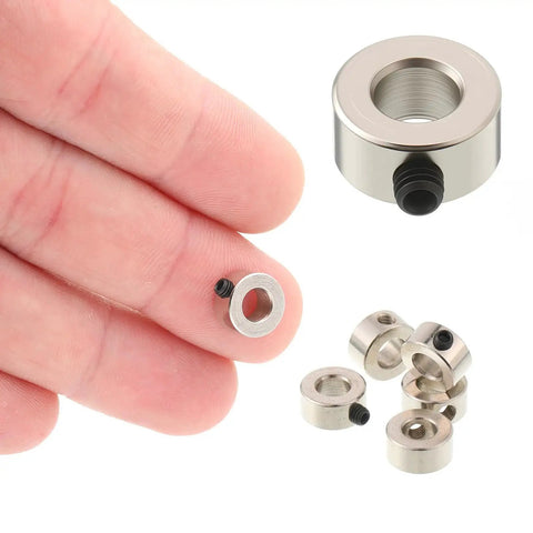 Close-up of 10 Pack Shaft Collars With Wrench And Screws 5.05mm Bore 10mm Outer Diameter 5mm Width Solid Steel Construction in hand and on surface