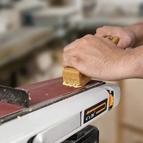 Two Pack Eight And A Half Inch Abrasive Cleaning Stick For Sanding Belts And Discs Natural Rubber Eraser in use on belt sander