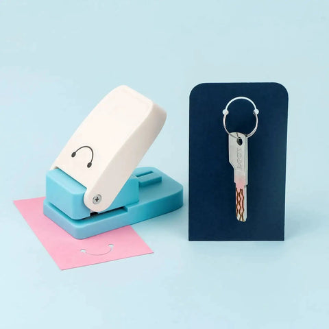Versatile Hangtag Punch For DIY Jewelry Displays And Card Tags, Corner Punch Tool with stainless steel blade, shown with cut cards.