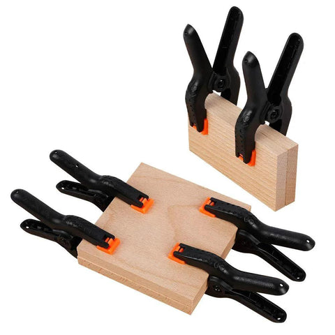 Ten Pack Heavy Duty 4.5 Inch Plastic Spring Clamps For Crafts Backdrops Photography And Home Improvement Projects Durable Nylon Construction With Ergonomic Round Handles And Anti Slip Grip used on wood blocks.