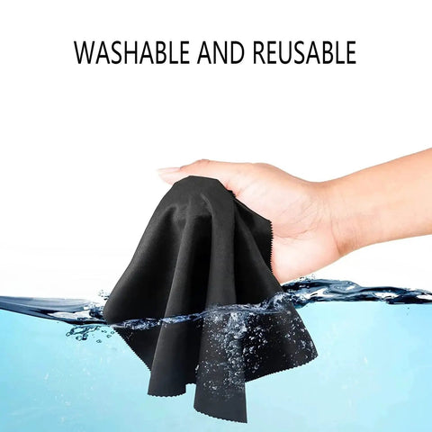 Hand holding black cloth in water, showcasing washable feature. 12 Pack Microfiber Cleaning Cloths For Glasses Screens Electronics 6 By 7 Inch.