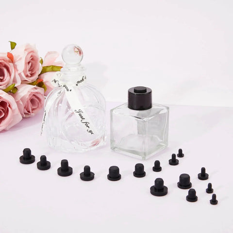 90 Pcs Silicone Rubber Hole Plugs Set With 9 Diameter Sizes next to glass bottles and flowers