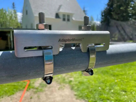 Junction Box Pipe Mount Bracket With Adjustable Clamps installed on a metal pole, showcasing outdoor stainless steel construction.