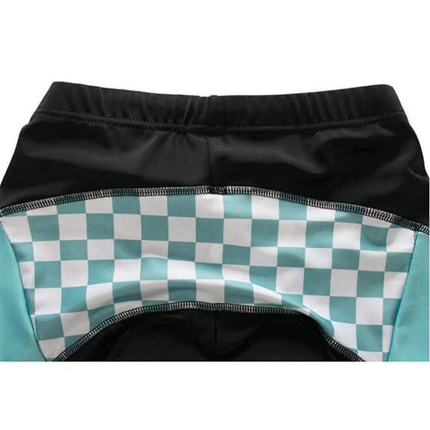 Close-up of cycling shorts with teal and white checkered design on the back panel.