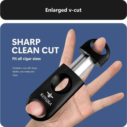 Close-up of a hand holding a v-cut cigar cutter from the Three Pack Cigar Cutter Set With Guillotine, V Cut, And Punch In One Gift Box For Men, Stainless Steel Tools, Portable Sharp Clean Cut That Fits All Cigars, Premium Cigar Accessories You Can Count On, showcasing its enlarged design.