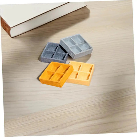 Four Grid Miniature Resin Storage Box Set For Dollhouses And Fairy Gardens on wooden surface