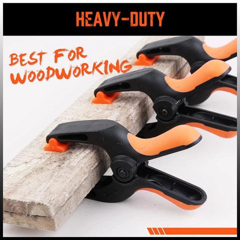 HORUSDY 5-inch heavy-duty spring clamps orange and black, woodworking clamps; three clamps gripping a wooden board