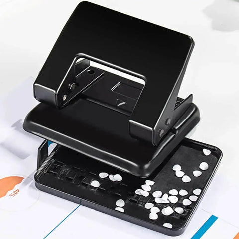 Heavy-Duty 2-Hole Punch Handheld Paper Punch for 20-Sheet Capacity With 50 Percent Less Effort and Built-In Waste Tray shown open.