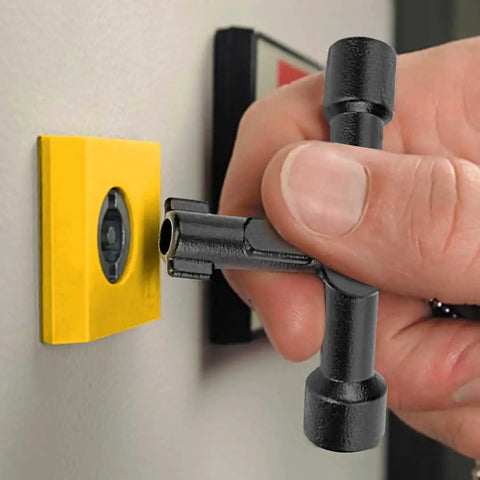 4-Way Universal Utility Cabinet Key in black unlocking a gas meter, close-up view, compact and durable tool for home and garage use