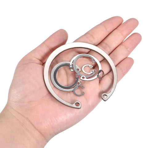 Hand holding Internal Retaining Ring Circlip 20Pcs 16mm 304 Stainless Steel Internal Circlip Snap Rings C Clips For Grooved Shafts Studs