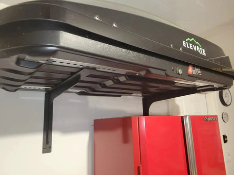 24 X 14.2 Inch Heavy Duty Rugged Shelf Brackets Set For 24 To 30 Inch Shelves installed under a black roof storage, shows vertical angle mounts.