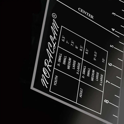 Close-up of Pro T Shirt Ruler Guide showing built-in size chart for easy accurate alignment of vinyl and sublimation designs on shirts.