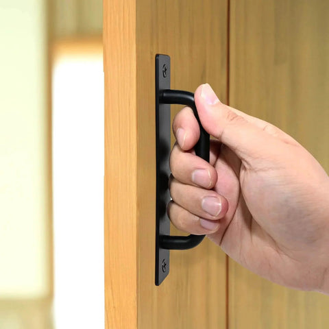 Hand pulling 5 Inch Black Barn Door Handle on cabinet
