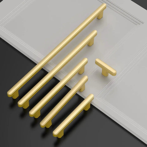 Gold Cabinet Pulls 5 Inch Center To Center 6.4 Inch Overall Length Brushed Gold Drawer Hardware set on black and white surface