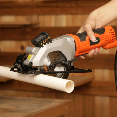 Person using Powerful 4 Amp Mini Circular Saw With Laser Guide And Vacuum Adapter to cut PVC pipe