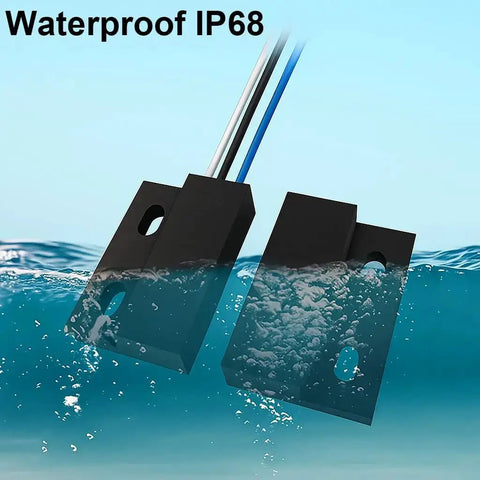 Three Sets NO NC Black Magnetic Door Sensor Reed Switch Kit submerged in water, showcasing IP68 waterproof design.