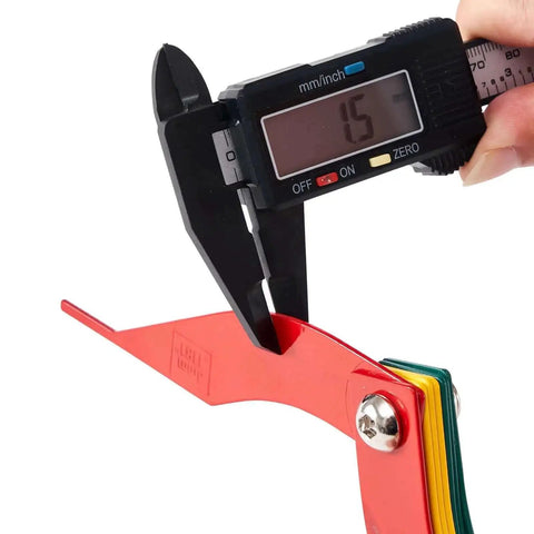 Digital caliper measuring red gauge, part of Brake Pad Thickness Gauge Tool Set Of 8 For Quick Brake Lining Check, color-coded sizes visible.