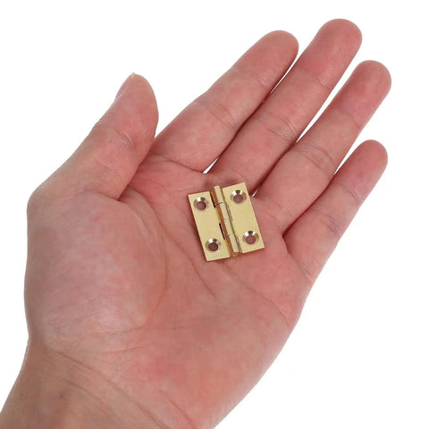 Foldable Brass Cabinet Door Hinges for Kitchens and Closets Small Door Hardware Thickened Design in hand