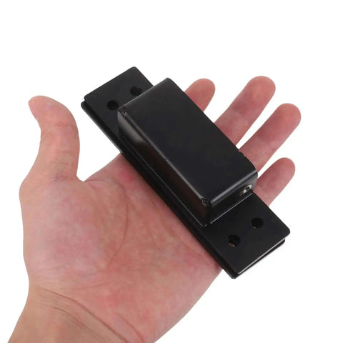 Hand holding Hidden Door Hinge 5 Inch Black Concealed Pivot for cabinets and secret doors heavy duty invisible cabinet hardware