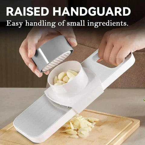 Versatile Mandoline Slicer KEOUKE With Six Interchangeable Blades Magnetic Back And Safe Hand Guard slicing garlic on a wooden board.