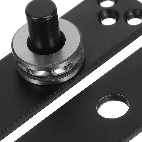 Close-up of heavy duty concealed stainless steel 360 degree pivot door hinge in matte black finish for wood cabinets and hidden storage projects.