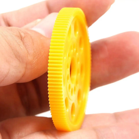 64P 96T Spur Gear for 1 To 10 On Road RC Cars, shown in hand detailing high precision plastic main gear, lightweight durable upgrade part.