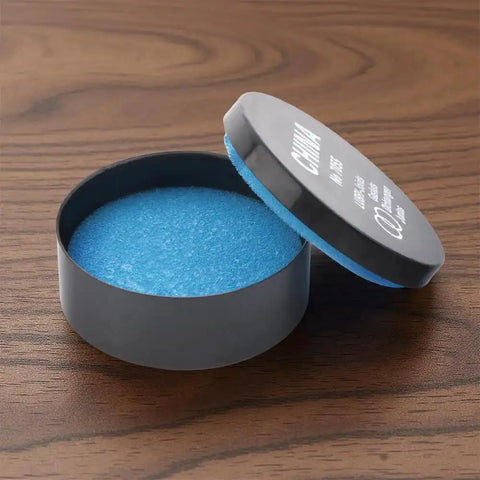 Pro Grade Watch Gasket Grease Silicone Lubricant For O-Rings And Case Backs in open black and blue container on wooden surface