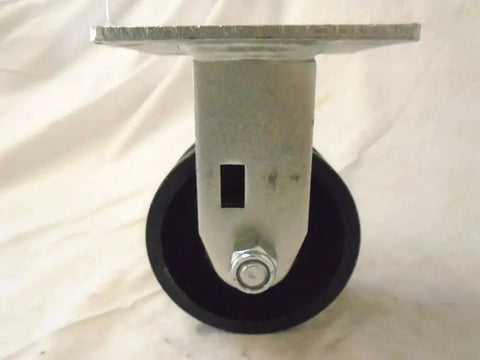 Front view of Rigid Caster With 7/8 Inch V-Groove Iron Steel Wheel, 4 By 2 Inch Footprint, 600 Pounds Capacity, Black Top Plate 4 By 4.
