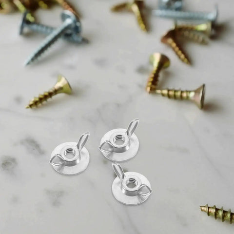 Close-up of 20 Pack Hurricane Shutter Wing Nuts 1/4-20 with Washer Base for quick release on marble surface, surrounded by screws.