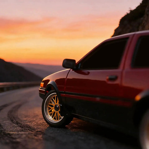 One Eighteen Scale RC Drift Car With Gyro Stabilization In Vintage Red driving on scenic road at sunset