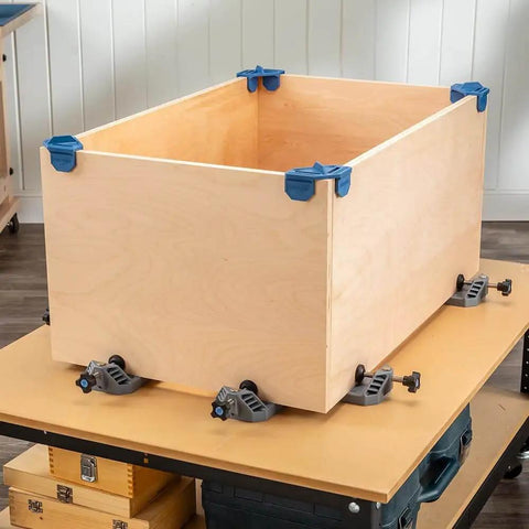 Clamp It Corner Woodworking Jig For 90 Degree Right Angle Cabinet Assembly Hands Free Pro Grade Panel Positioning And Precise Alignment In Woodworking Cabinets Casework And Carpentry Projects assembled on a wooden box for demonstration.