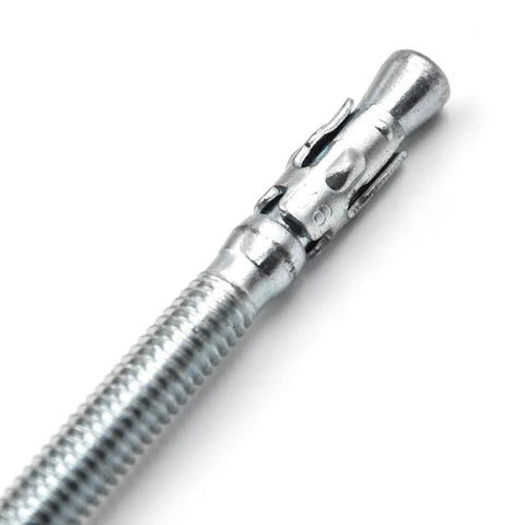 Close-up of a Quarter Inch By Four Inch Heavy Duty Zinc Wedge Anchor for Concrete, showing detail of zinc coating and wedge design.