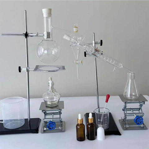 Scientific setup with two Stainless Steel Lab Jack Stand Scissor Lift Table 4x4 Inch Adjustable Height beneath chemistry glassware.