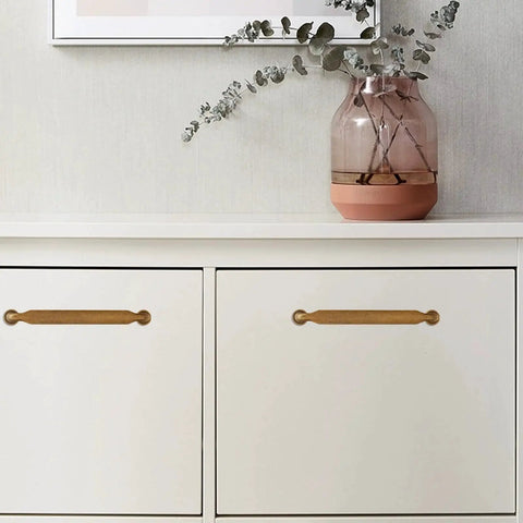 Antique Brass Cabinet Pulls 5 Inch 128mm Hole Centers Zinc Alloy Vintage Drawer Handles for Kitchen Cabinets 10 Pack installed on white cabinet