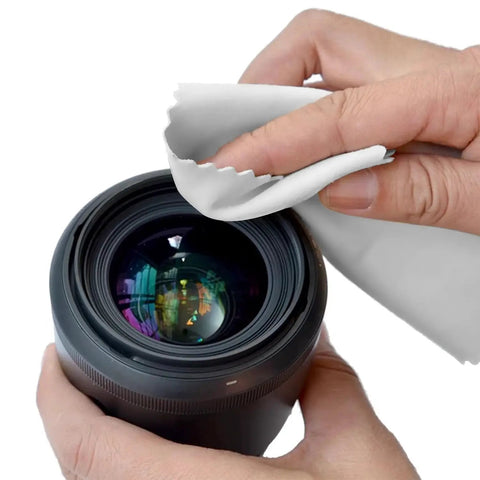 Person cleaning camera lens with 30 Pack Lint Free Microfiber Cleaning Cloths for Glasses Lenses and Screens.