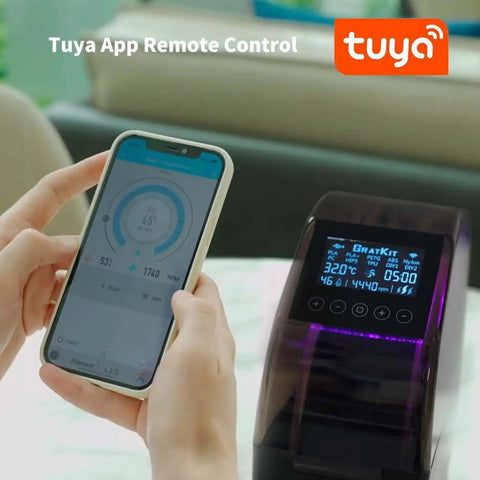 Person controlling Firefly V2.0 3D Filament Dryer Box with Tuya App, showing screen and smartphone interface.