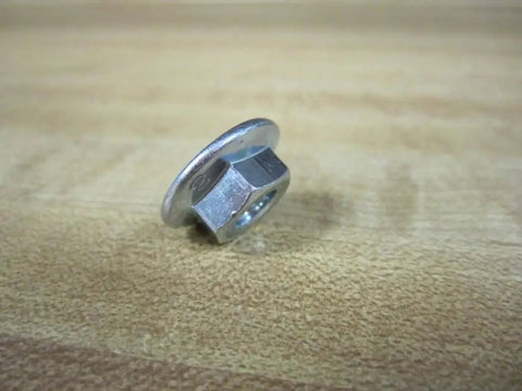 Hex Nut Fastener 5/16-18 Coarse Thread Pack of 6, PN 3842523561 on wooden surface, industrial machine hardware close-up