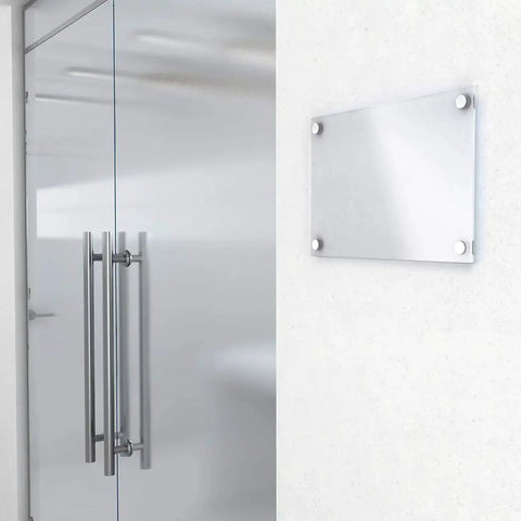 Glass door and wall with Polished Stainless Steel Mirror Screw Caps 10mm Decorative Covers for Screws Set of 8 visible on a metal frame.