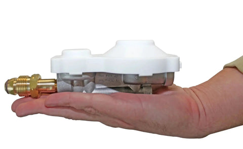 Person holding Heavy Duty Horizontal Mounted 300000 BTU Two Stage Propane Regulator With POL for RVs and campers in hand