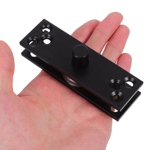 Hidden Door Hinge for Wood Doors and Secret Bookcases, heavy duty stainless steel 360 degree rotation pivot shown in hand