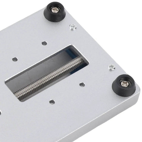 Universal Bearing Fixing Tool For Circuit Board Repair Fixture, metal surface with screws and clamps, side view.
