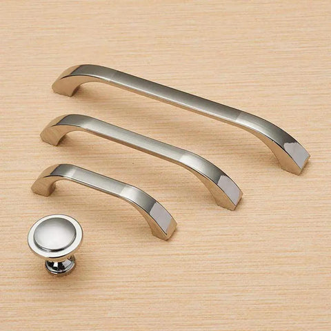 Brushed Nickel Cabinet Handles Three Pack With 64 Millimeter Hole Centers Euro Style Drawer Pulls in various sizes displayed on wood surface