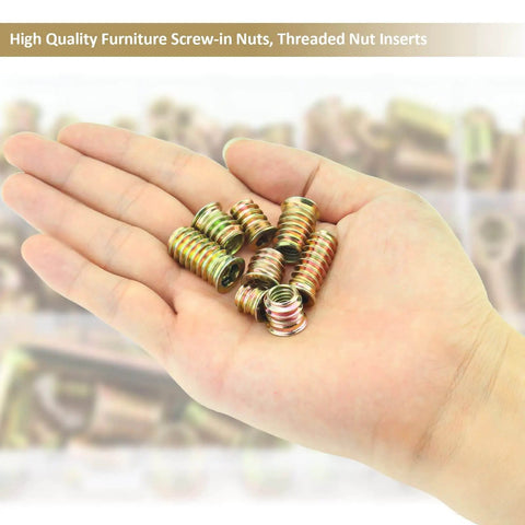Close-up of hand holding steel nut inserts from 152 Piece Threaded Inserts Set For Wood, 1/4-20 and 5/16-18, DIY kit