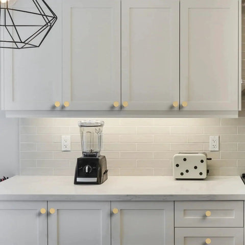 Champagne Bronze Knurled Cabinet Knobs 10 Pack for Cabinets and Drawers Kitchen Cupboard Dresser Hardware shown installed on white cabinets