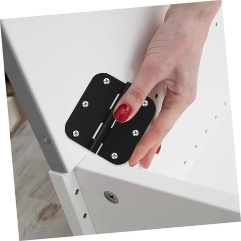 Person installing Heavy Duty Iron Door Hinges 2 Pack With Rounded Corner Design For Cabinets And Outdoor Gates on a cabinet